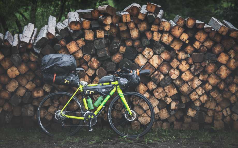 Bicycle against stacked wood